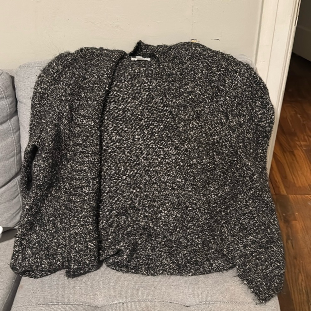This is a cute black and white sweater cardigan in a size XL